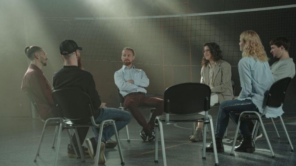 Group therapy session supporting emotional sobriety in addiction recovery