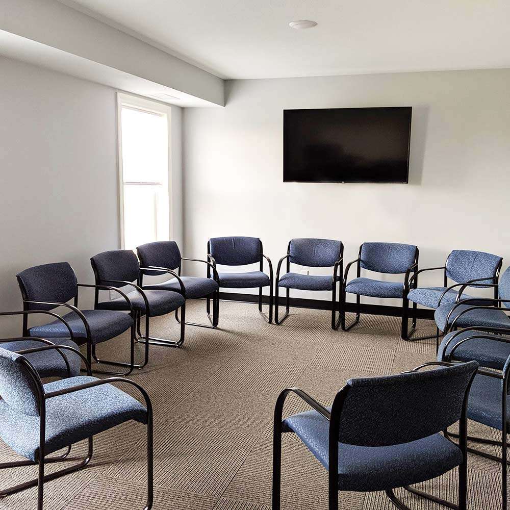 Shakopee - Men's Residential Treatment Center - Group Circle Room With Chairs and a TV